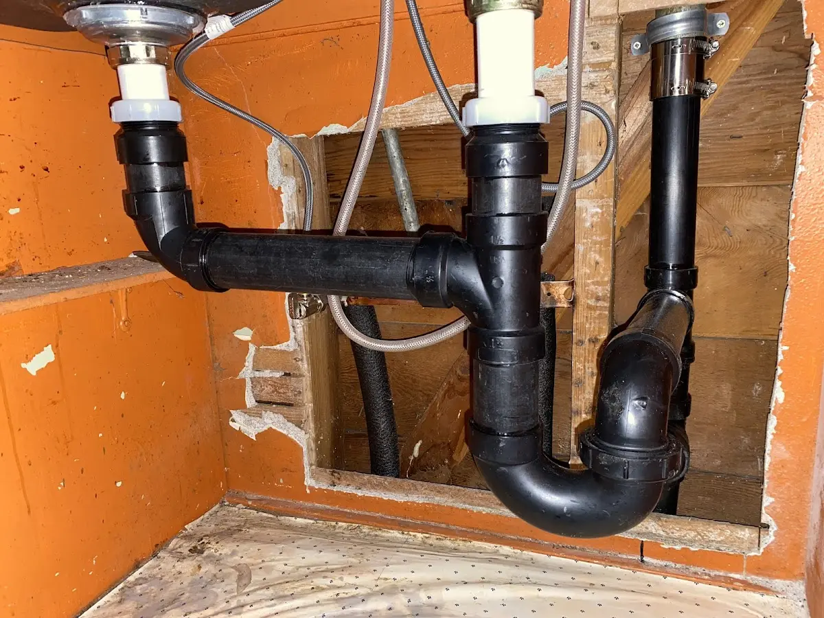 Professional Garbage Disposal Repair equipment and tools on the job in St. Johns